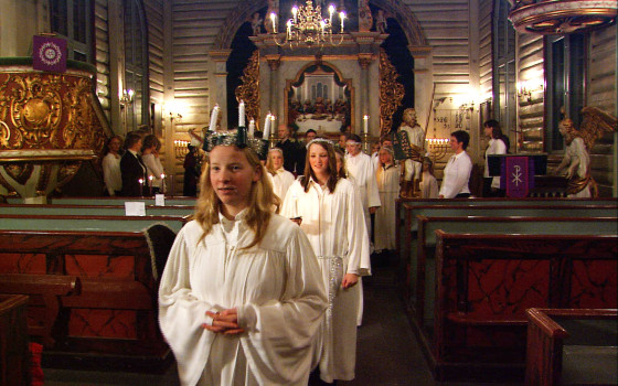 Norwegian girls celebrate the feast of Santa Lucia on Dec. 13 with a candlelight procession. 